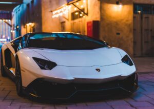 Luxury Cars - White sports car with sleek design parked in an #14196938