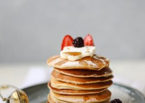 Food Aesthetics - Stack of pancakes topped with assorted fresh ber #17165552