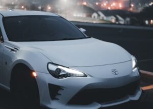 Luxury Cars - A white sports car with illuminated headlights p #17245117