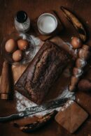 Food Aesthetics - Top view of homemade banana bread with eggs, mil #17832591