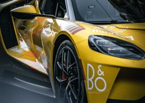 Luxury Cars - Sleek yellow sports car parked at a nighttime ra #34214698