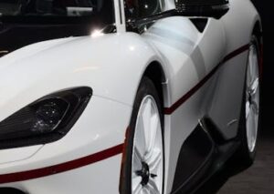 Luxury Cars - Close-up of luxury white sports car with bold re #34564763