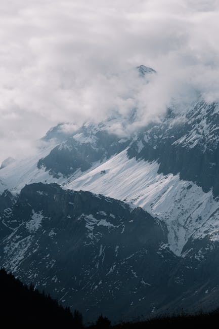 Mountain Landscapes - Scenic view of a snow-capped mountain range shro #34720267
