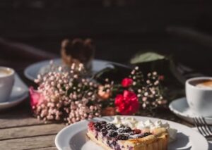 Food Aesthetics - Delicious berry tart with cream served alongside #35121850