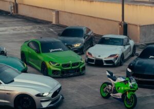 Luxury Cars - Group of sports cars and a motorcycle in an urba #36542621