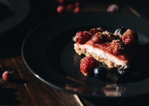 Food Aesthetics - Delicious slice of cheesecake with raspberries a #4051730