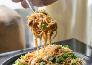 Food Aesthetics - Delicious stir-fried noodles topped with fresh v #5348719