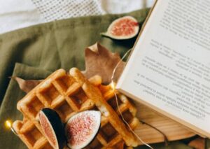 Food Aesthetics - Warm waffles topped with fresh figs, set on a te #5377451