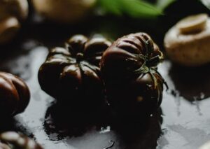 Food Aesthetics - Wet mushrooms and heirloom tomatoes arranged on #5500970