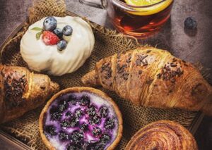 Food Aesthetics - A selection of pastries with blueberries, cream, #7332909