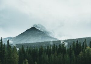 Mountain Landscapes - Scenic view of a misty mountain surrounded by a #9651398